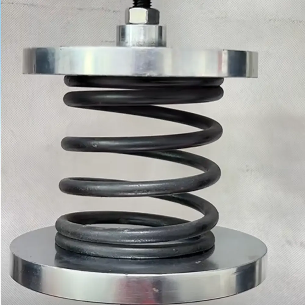 Spring compression load-deflection test between circular compression platens