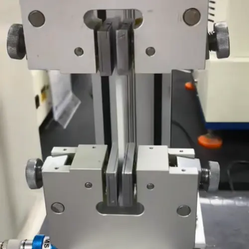 Example actuated grip for repeatable specimen clamping