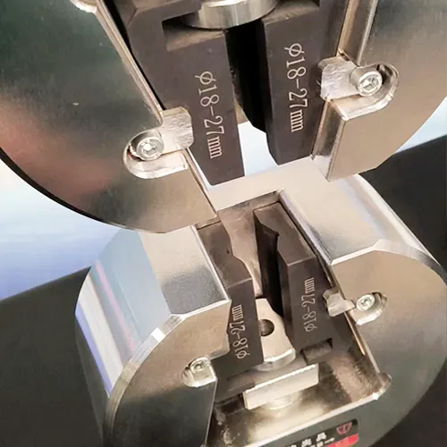 Example tensile grip and fixture for a universal testing machine