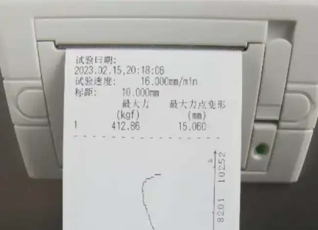 Instrument result printout showing box compression test speed, peak force and deformation at peak force