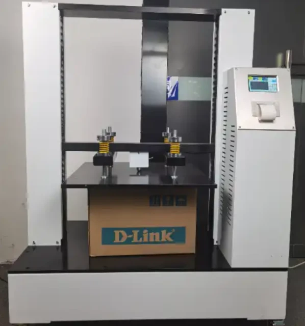 Corrugated transport package positioned between the platens during a box compression test